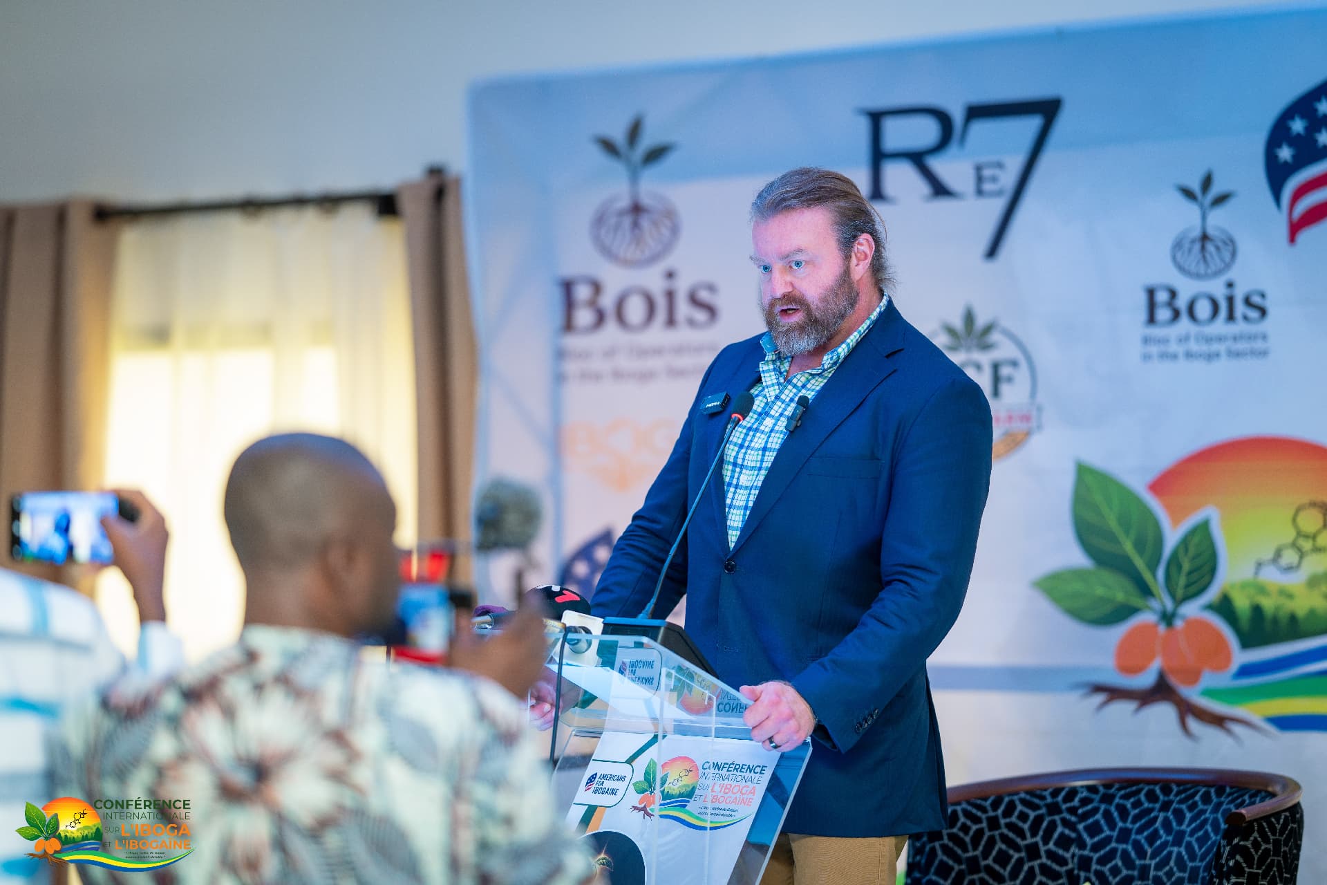 International partner speaking at the conference lectern