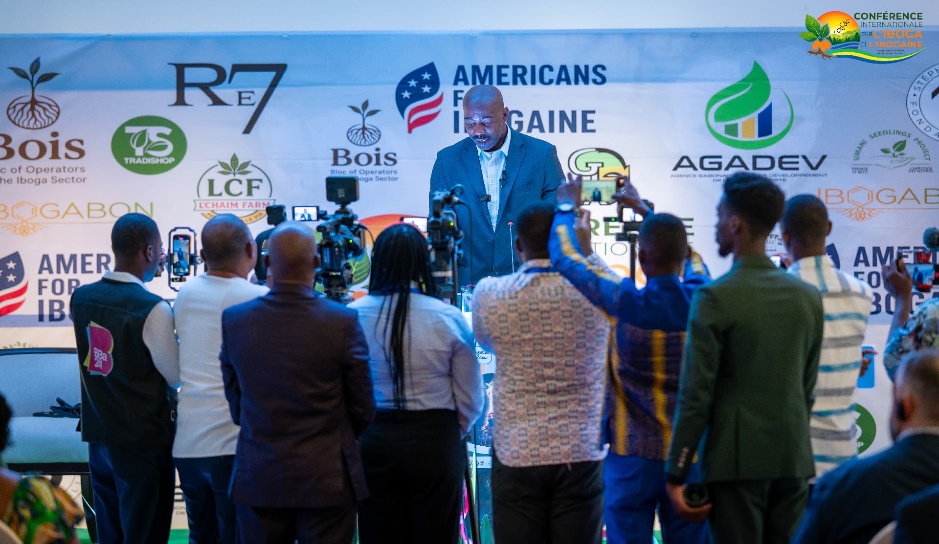 Speaker addressing press and delegates from the conference podium in Libreville
